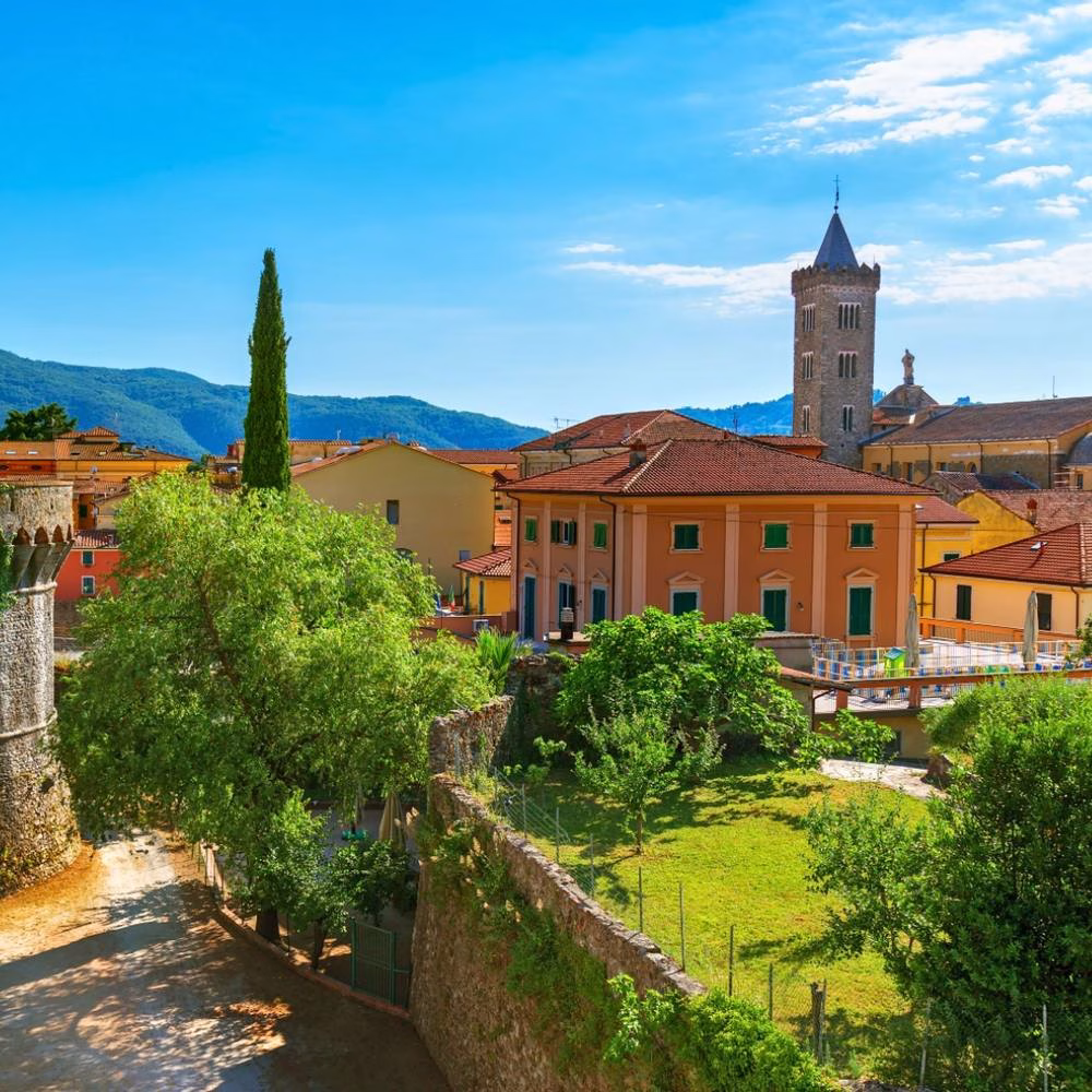 View over Sarzana's terracotta rooftops and bell tower from the old fortress walls, a classic Sarzana day trip view